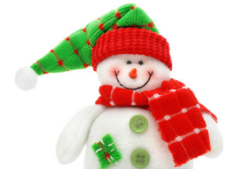 smiling snowman toy dressed in scarf and cap