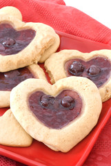 Heart Shaped Fruit Filled Cookies on Red Plate