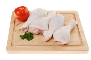 Raw chicken legs isolated on white background