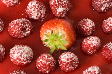 delicious strawberry between juicy raspberries