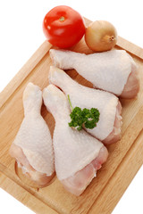 Raw chicken legs isolated on white background