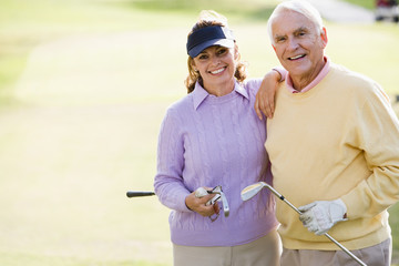 Couple Enjoying A Game Of Golf