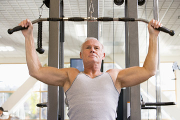 Fototapeta premium Man Weight Training At Gym