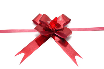 Red ribbon bow isolated on white background.