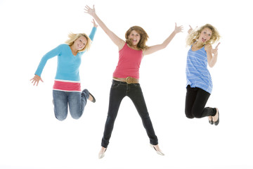 Teenage Girls Jumping In The Air
