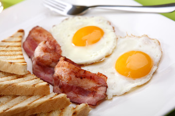 Breakfast - toasts, eggs, bacon