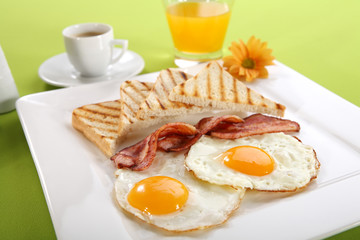 Breakfast - toasts, eggs, bacon