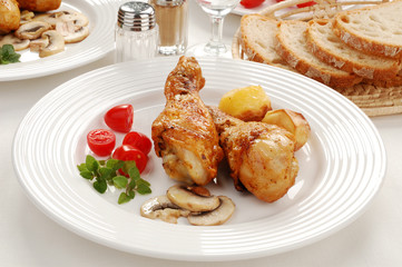 Roasted chicken legs with vegetables