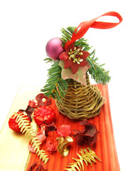 Dried plants and wicker bell as Christmas ornaments