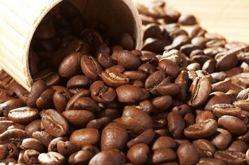 Cup with coffee, costing on coffee grain
