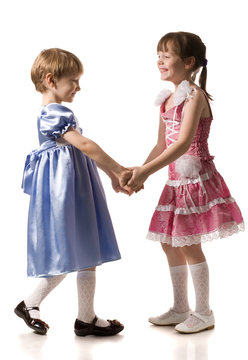 two girls hold hands of each other