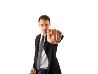 A young businessman indicating on white background