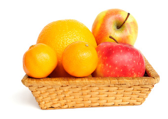 Basket with fruit isolated on white