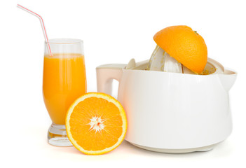 Juice extractor with a glass of orange juice isolated on white