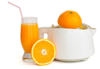 Juice extractor with a glass of orange juice isolated on white