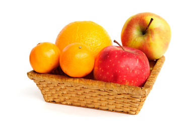 Basket with fruit isolated on white