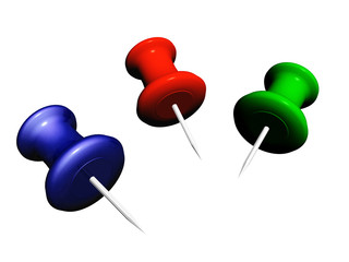 three colored drawing pins isolated on white