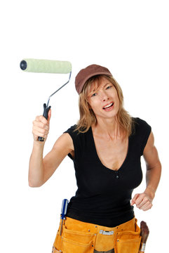 Angry female painter waving a paint roller