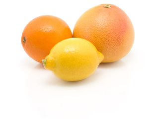 orange, lemon and grapefruit on white background