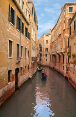 Fototapeta na wymiar Venice-Gondoliers and Canal