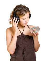 Young woman in headphones enjoying listening to music