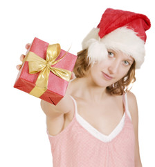 Girl in a santa clause cap with present
