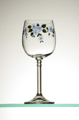 Painted a foted tumbler on a wine