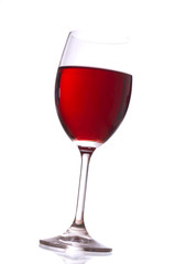 Glass with red wine on white background