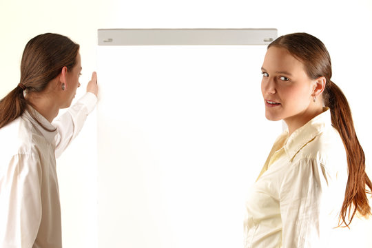 Two young colleagues front of the clipchart