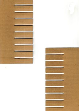 pieces of cardboard box (combs)