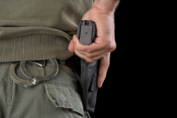 Hand on a gun