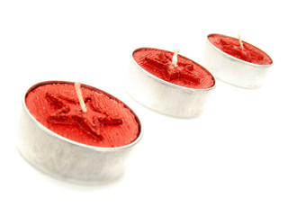 Red candles with stars as Christmas decoration