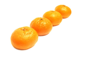 Pile of tangerines isolated on white.