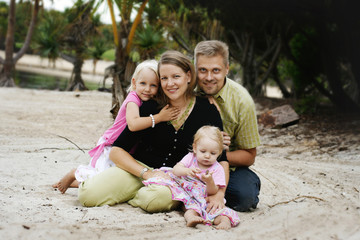 Fototapeta na wymiar Happy family at the beach