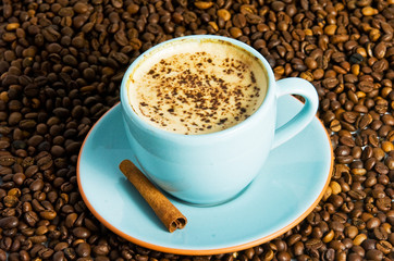 cappuccino on white background with coffee beans