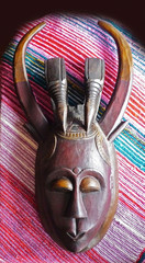 Face of asian idol with horns