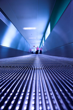 Blue moving escalator in the office hall