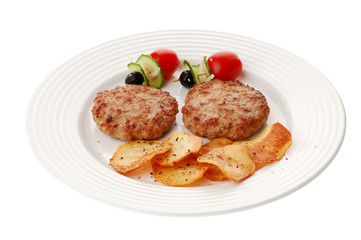 Fried steaks with chips and vegetable salad isolated on white