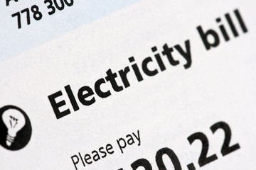 Electricity Bill statement close-up. Concept for price rise, cost of living, energy bills, fuel, and inflation. - obrazy, fototapety, plakaty