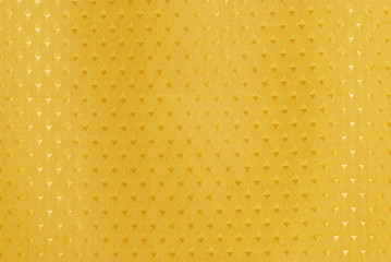 Gold fabric with diamond shapes making a background