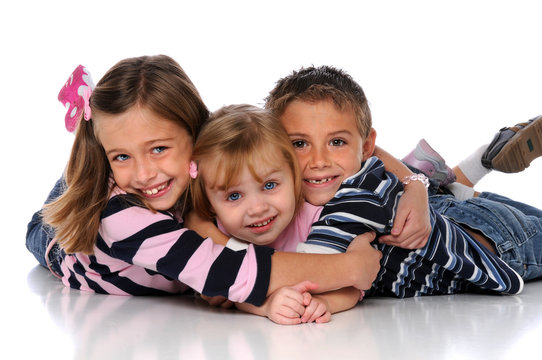 Children Embracing Laying on the Floor