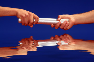 hands passing the batton