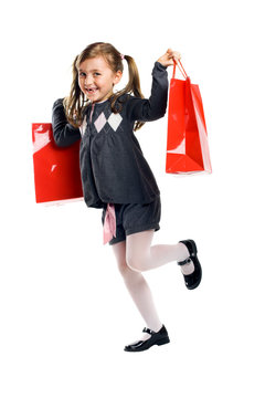 smiling girl isolated on white with shopping bags