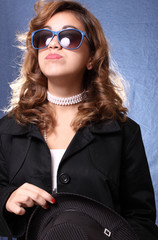 Woman posing on a blue background