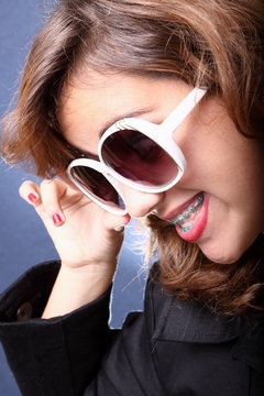 Woman posing with sunglasses