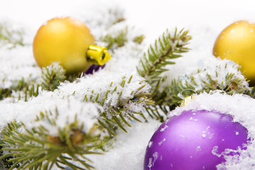 Fototapeta na wymiar Christmas balls in snow isolated on white