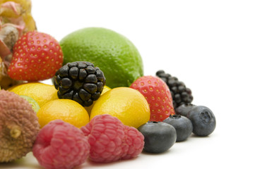 fresh berries and fruits on white background
