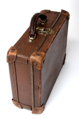 old suitcase for traveling on a white background