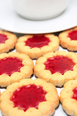 Cup of tea and cookies on foreground.