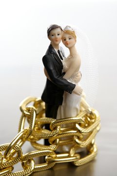 Metaphor of marriage as a loss of freedom, with chains